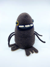 Load image into Gallery viewer, dark brown sweater monster with three teeth and four arms