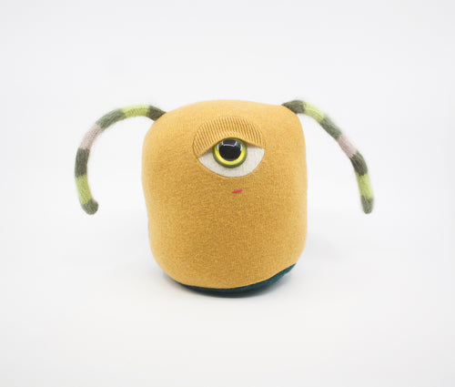 stuffed cyclops plush toy made from yellow wool sweater