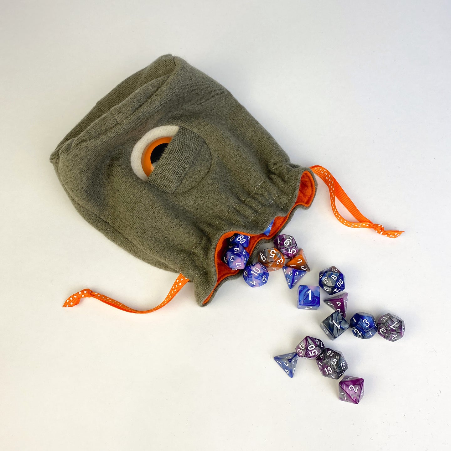 cyclops drawstring dice bag with orange eye