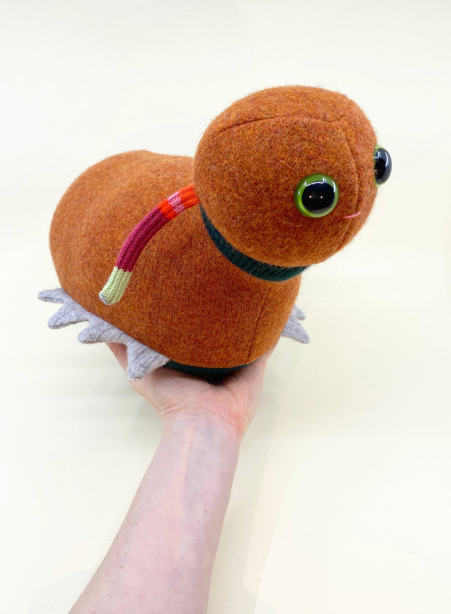 cute orange caterpillar style plush toy