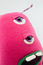 Load image into Gallery viewer, bright pink monster with two eyes and pocket mouth
