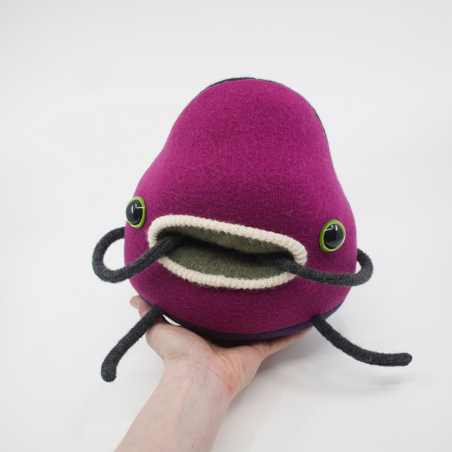 pink cuddly plush monster with cashmere pocket mouth