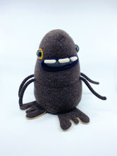 Load image into Gallery viewer, dark brown sweater monster with three teeth and four arms
